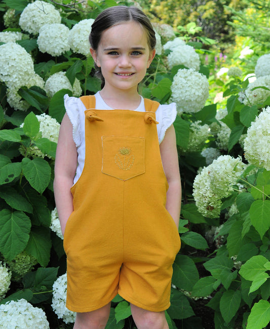Below the Kōwhai Baby/Child Tipa Dungarees